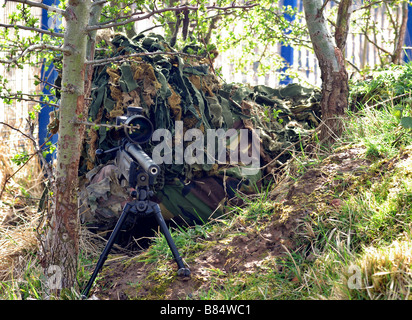 Sniper in Ghillie suit Stock Photo