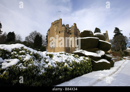 Exterior view of Crathes Castle and grounds near Banchory, Aberdeenshire, Scotland, UK covered in snow during winter Stock Photo