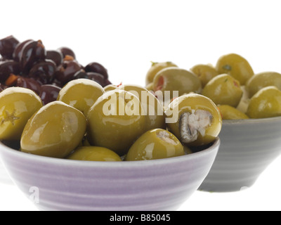 Bowls Of Mixed Green And Black Healthy Ripe Savoury Olives Isolated Against A White Background With A Clipping Path And No People Stock Photo