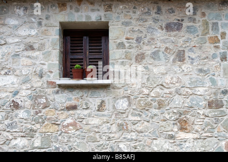 Window view with flower port in interior courtyard of Kykkos Monastery, Troodos mountains, South Cyprus Stock Photo