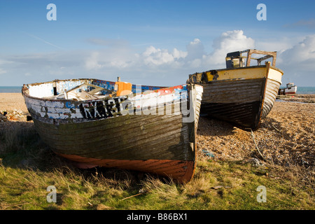 Two abandoned wrecked fishing boats on the Dungeness shingle shore in Kent, UK Stock Photo