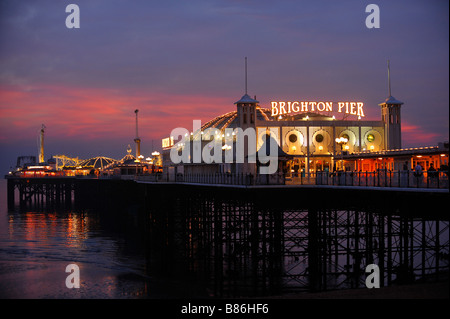 Brighton Pier at dusk with the night life just starting. Picture by Jim Holden. Stock Photo