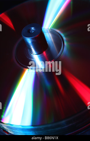 stack of CD's on a spindle lit with red and blue studio lighting Stock Photo