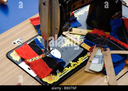 Old-school sewing machine at Tibetan school for women. They learn the craft of sewing. Stock Photo