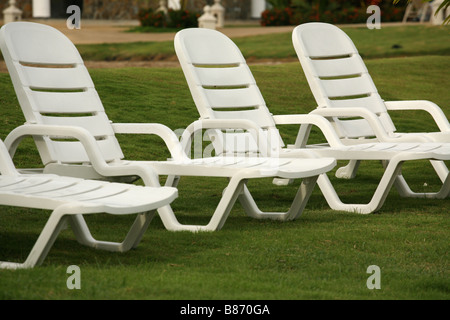 Empty white chairs at the beach in a resort in Panama. Stock Photo