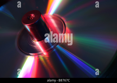 stack of CD's on a spindle lit with red and blue studio lighting Stock Photo