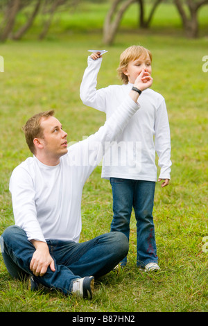 Father touching his son s nose Stock Photo