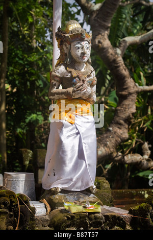 Statue of a Hindu deity in the Trader s Shrine at Rambut Siwi Temple Bali Stock Photo