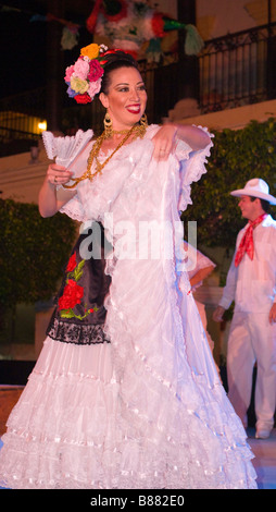 MEXICO SINOLA STATE MAZATLAN Smiling woman Folk Dancer in National Costume Performing on stage. Plaza Machado. Old Mazatlan Stock Photo