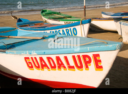 MEXICO SINOLA STATE MAZATLAN Fleet of colorful small fishing boats on Olas Altas beach. Old Mazatlan Stock Photo