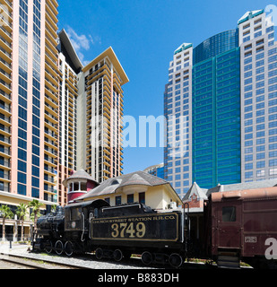 Orange Blossom Special train in front of the SunTrust Tower, Church St Station, Business District, Downtown Orlando, Florida Stock Photo