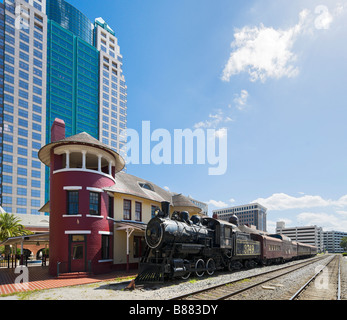 Orange Blossom Special train in front of the SunTrust Tower, Church St Station, Business District, Downtown Orlando, Florida Stock Photo