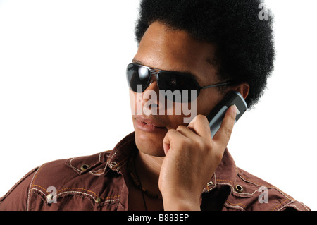 Portrait of young trendy african hispanic man using cell phone - isolated Stock Photo