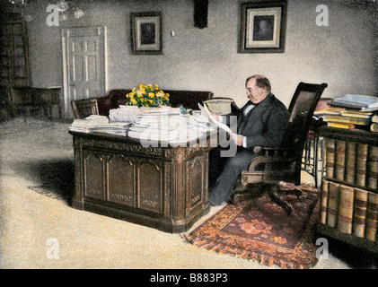President Grover Cleveland at his desk in the White House. Hand-colored halftone of a photograph Stock Photo