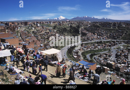 Market day in El Alto, Mt Huayna Potosi (centre) and Mt Chacaltaya (R) in background, La Paz, Bolivia Stock Photo