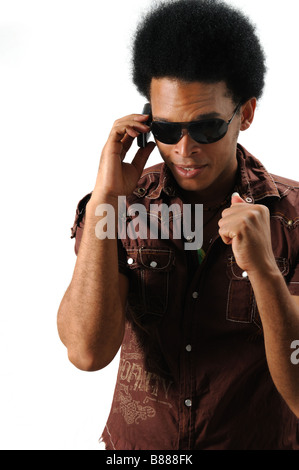 Portrait of young trendy african hispanic man using cell phone - isolated Stock Photo