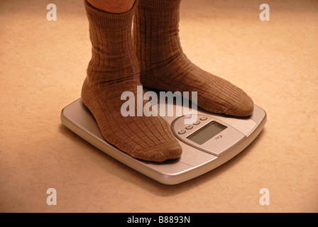 Closeup Of Man's Feet On Weight Scale Indicating Overweight Stock Photo,  Picture and Royalty Free Image. Image 33443183.