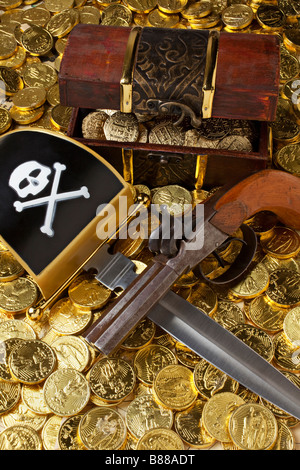 Treasure chest with gold coins sword and gun Stock Photo