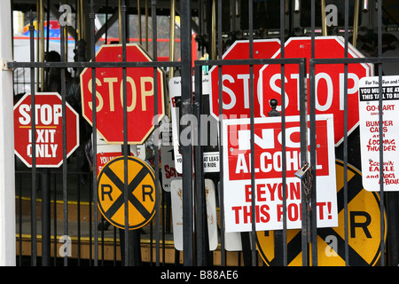 Stacked warning signs at amusement park Stock Photo