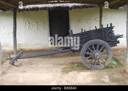 Bullock Cart of infront of Gond Tribal;s Hut. Manav Sangrahalaya, Bhopal, Madhya Pradesh, India. Stock Photo