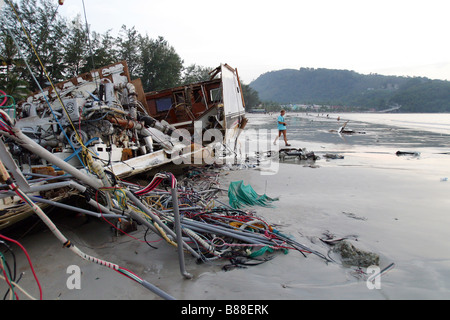 A gutted boat washed ashore on Patong Beach on Phuket Island, Thailand after the December 26, 2004 tsunami. Stock Photo