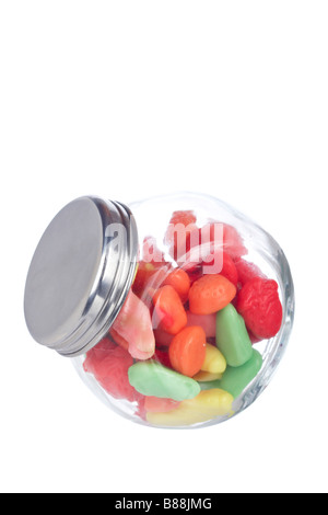 Colorful candies in the glass jar isolated on white background Stock Photo