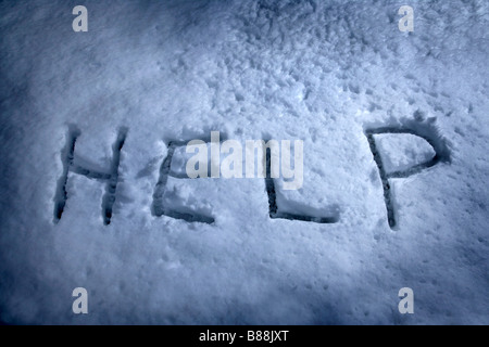 Word 'help' written in the snow Stock Photo