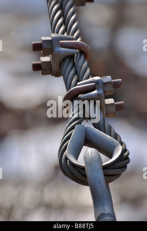 Closeup of steel eye bolts and clamps on a cable for a suspension bridge Stock Photo