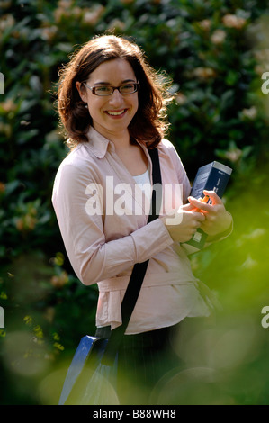 Student with book and bag on a campus. Stock Photo