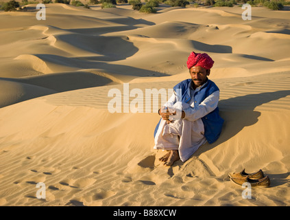 Indian man in desert Khuri Rajasthan India Stock Photo