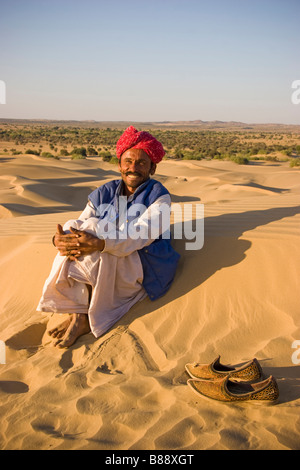 Indian man in desert Khuri Rajasthan India Stock Photo