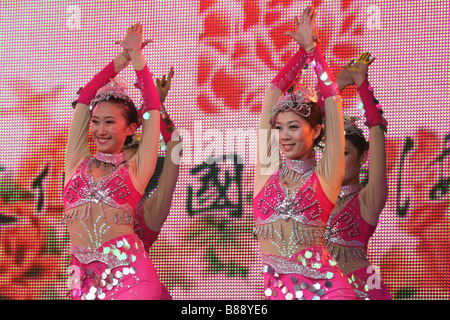 china chinese stage singers female women girls costume street performers artists dancers dancing new year of the ox london uk Stock Photo
