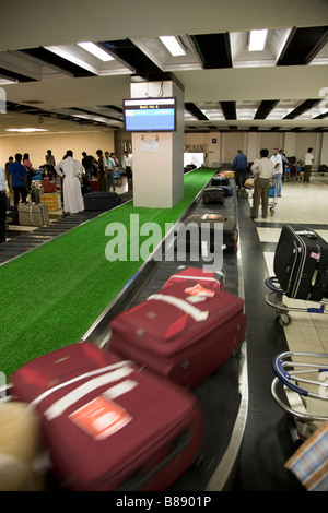 Passengers luggage / baggage reclaim carousel belt in Mumbai / Bombay International airport, India. Stock Photo