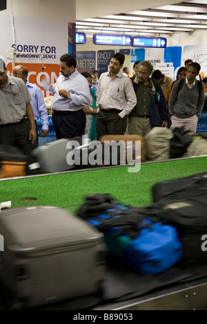 Passengers luggage baggage reclaim carousel belt in Mumbai / Bombay International airport, India. Stock Photo