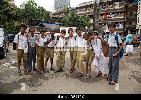 Indian school boys in the yard outside their block of flats after school. Mumbai, India. Stock Photo