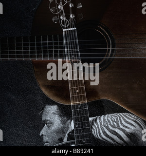 Abstract portrait of young man with acoustic guitar over grunge texture Stock Photo