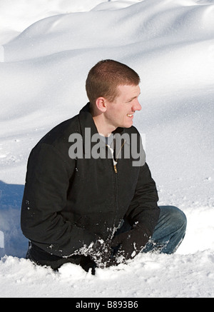 Young man enjoying a fresh snow fall Stock Photo