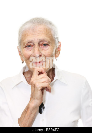 Portrait of a senior woman smiling in camera Isolated over white background Stock Photo