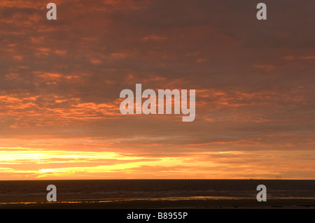 Sunset over the Irish Sea from Cleveleys Lancashire towards the Barrow off shore wind farm Stock Photo
