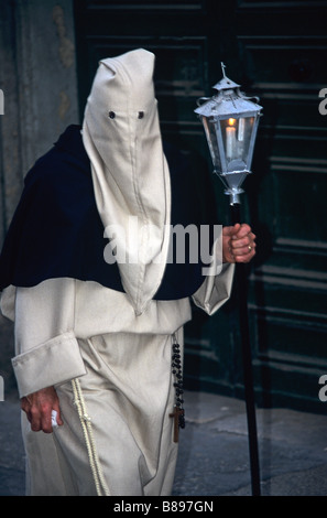 White Penitent & Lamp in Easter Parade or Holy Week Procession, Valletta, Malta Stock Photo