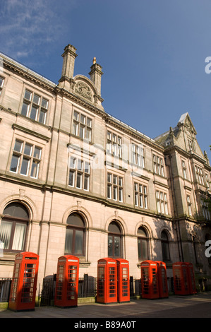 Traditional red telephone boxes in Preston Lancashire United Kingdom Stock Photo