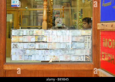 Dubai money exchange shop window displaying faded banknotes located in the 'Dubai Old Souk' open air market in United Arab Emirates Asia Stock Photo