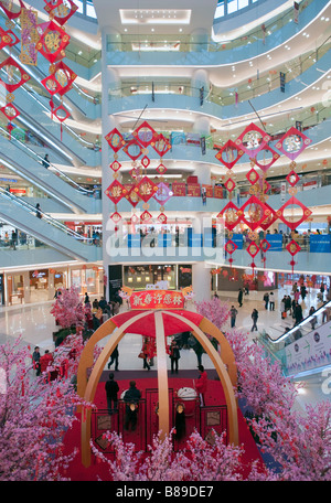 Interior atrium of modern APM shopping mall on Wangfujing street in ...