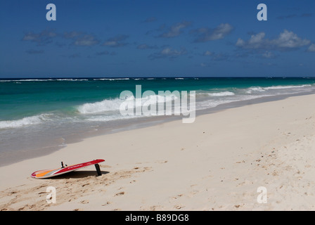 A wonderful beach of Barbados with a surfboard Caribbean Stock Photo