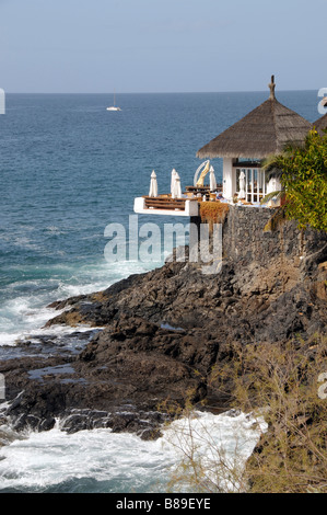 Costa Adeje Tenerife Canary Islands property built into rockface overlooking Atlantic Ocean Stock Photo