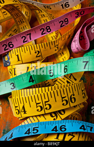 Different colored tape measures Stock Photo