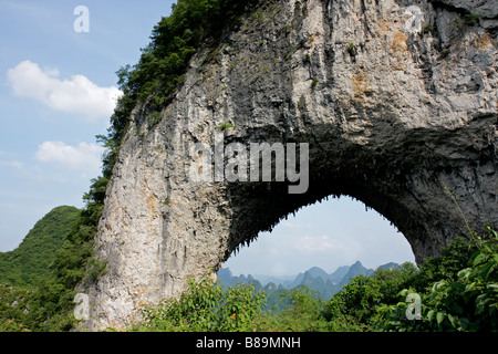 Famous moon hill limestone arch near Yangshou, Guangxi region, China Stock Photo