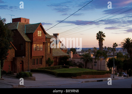 Beautiful brick house on top of Los Angeles city at twilight Stock Photo