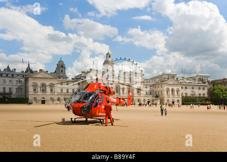 Horizontal wide angle of London's Air Ambulance landed to attend an emergency in central London in Horse Guard's Parade. Stock Photo