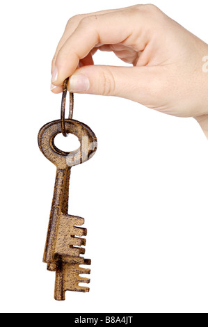Three keys in the hand a over white background Stock Photo